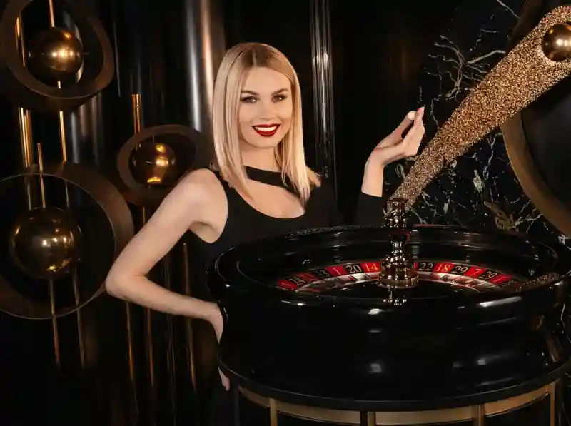 SkyCrown Casino live roulette dealer beside a spinning roulette wheel